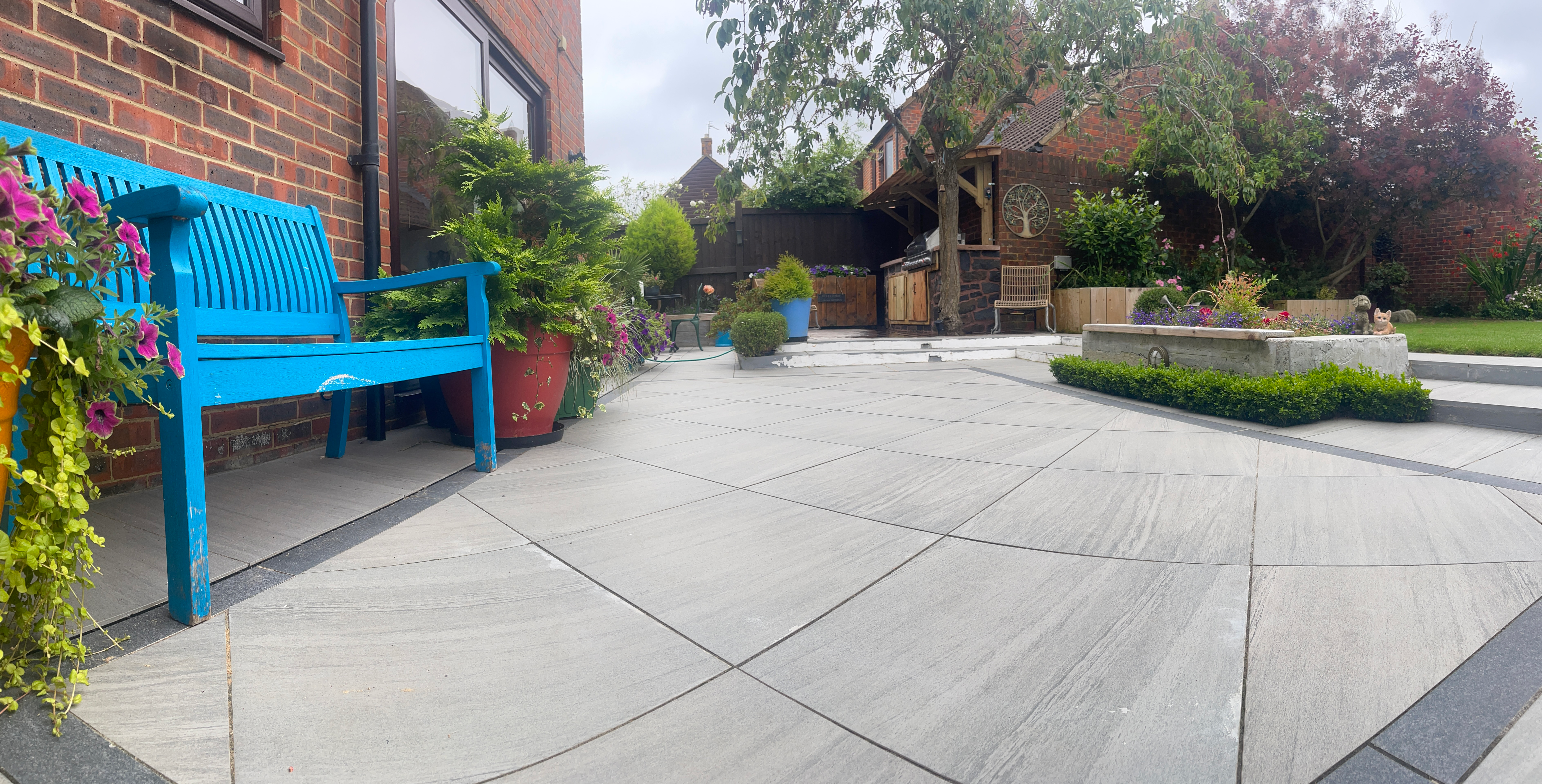 Grey porcelain patio in Milton Keynes garden